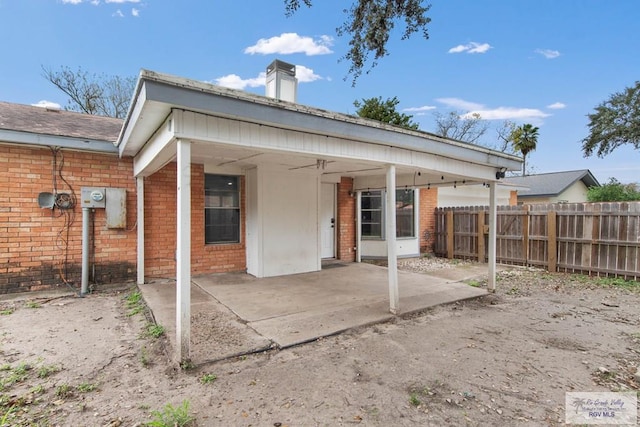 rear view of house featuring a patio and ceiling fan