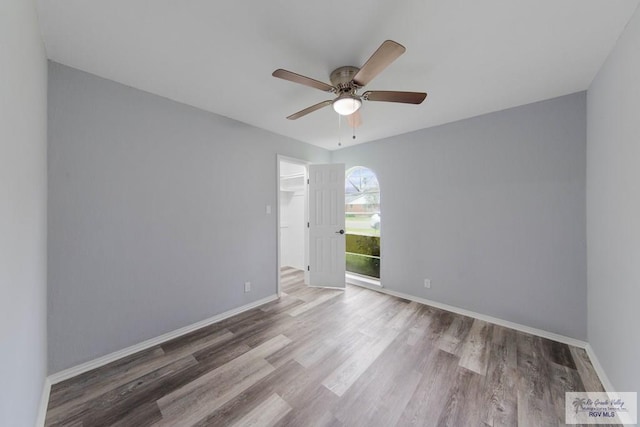 1722 High St, Harlingen, TX 78550 - spare room with ceiling fan, wood finished floors, and baseboards