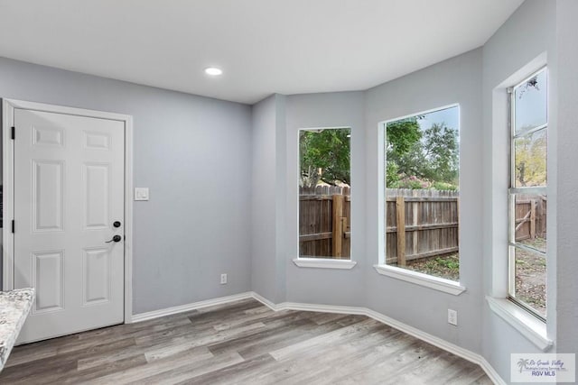 spare room featuring light hardwood / wood-style floors