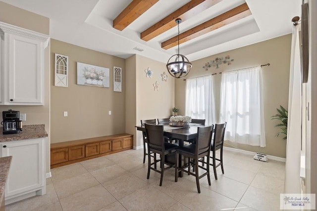 tiled dining area with beamed ceiling and an inviting chandelier