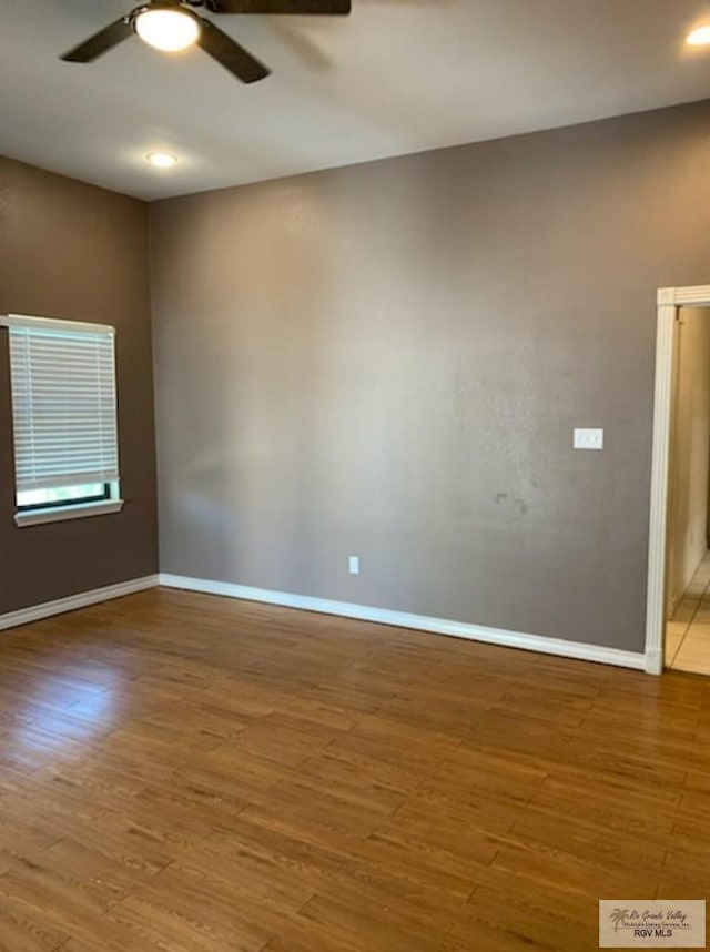 unfurnished room featuring wood-type flooring and ceiling fan