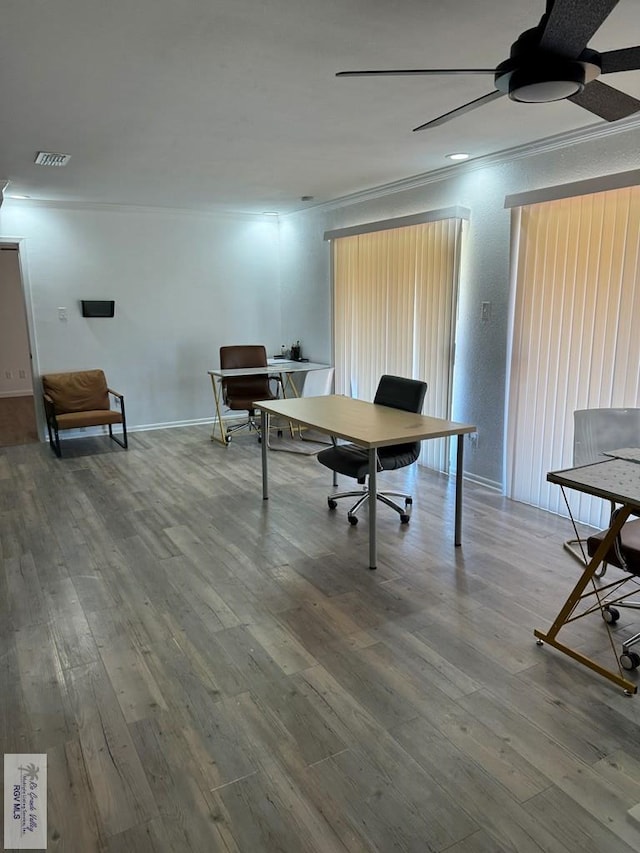 office space with hardwood / wood-style flooring and crown molding