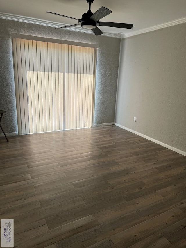 spare room featuring ceiling fan, dark hardwood / wood-style floors, and ornamental molding