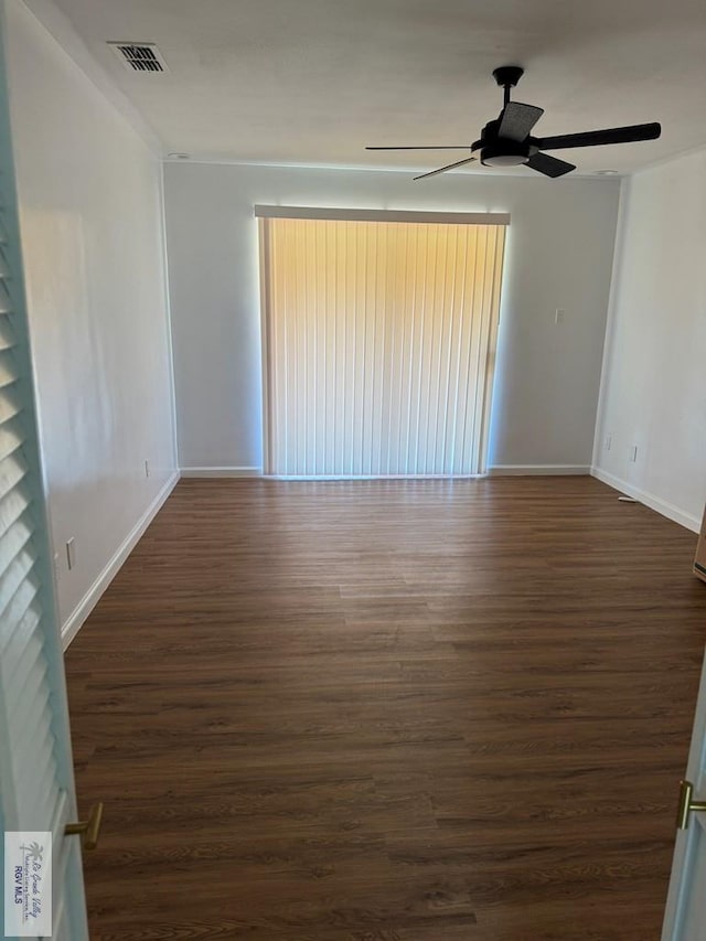 empty room featuring dark hardwood / wood-style floors and ceiling fan