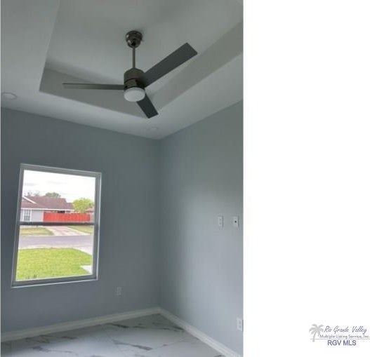 unfurnished room featuring ceiling fan