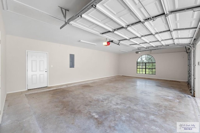 garage with electric panel and a garage door opener