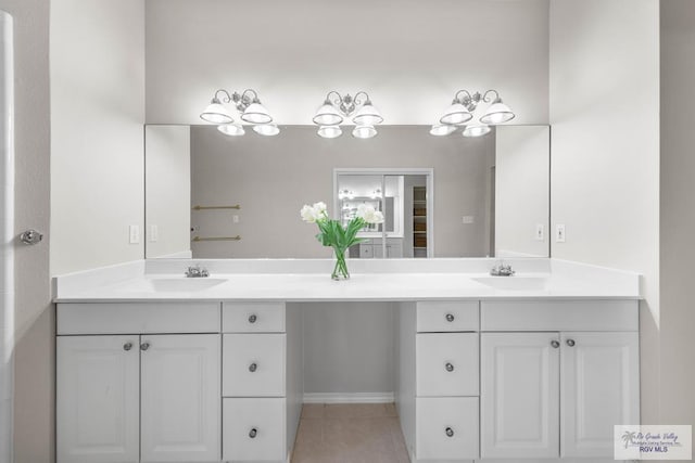 bathroom with tile patterned floors and vanity