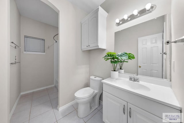 full bathroom featuring tile patterned flooring, vanity, toilet, and washtub / shower combination