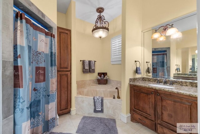 bathroom featuring tile patterned flooring, vanity, and separate shower and tub