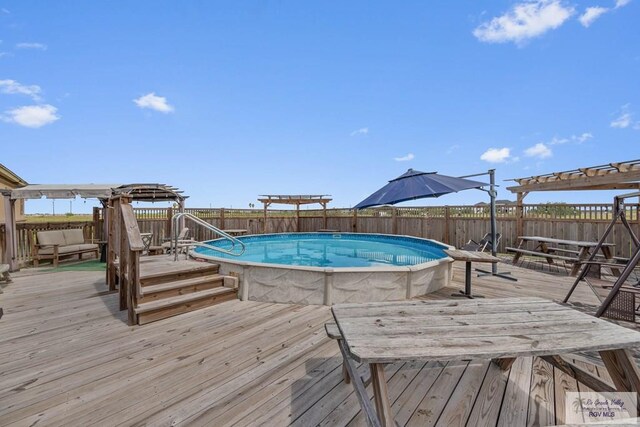 view of pool featuring a wooden deck