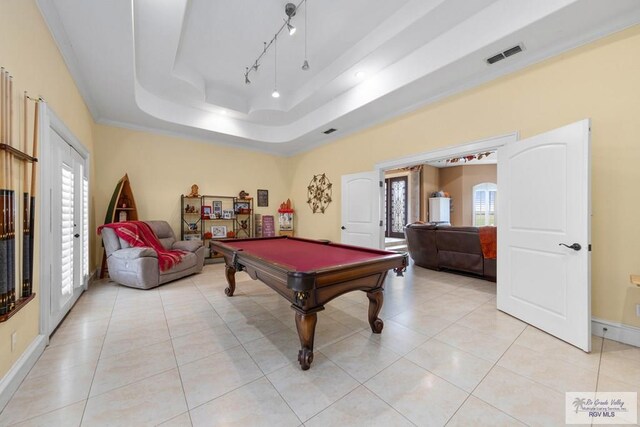 playroom featuring a raised ceiling, crown molding, light tile patterned floors, and billiards