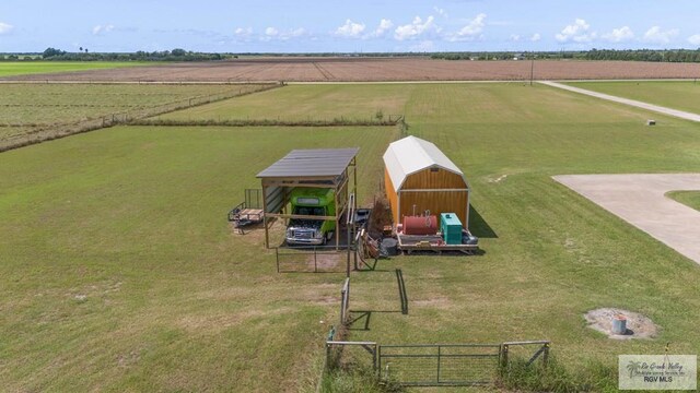 birds eye view of property featuring a rural view