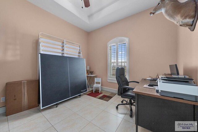 office space featuring tile patterned floors and ceiling fan