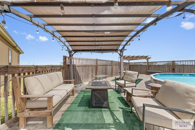 view of patio featuring a pergola, a fenced in pool, and an outdoor living space with a fire pit