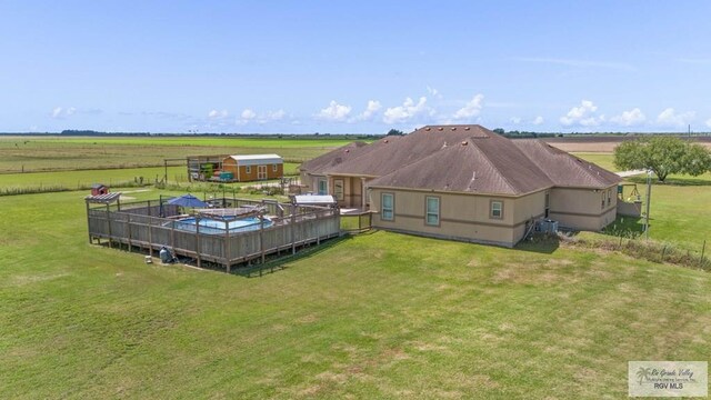 birds eye view of property featuring a rural view