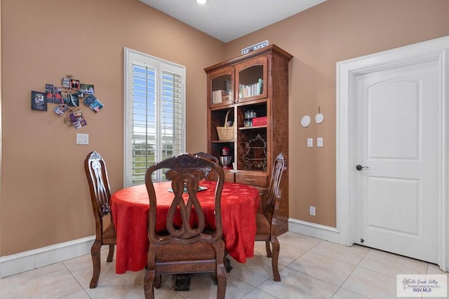 dining space featuring light tile patterned floors