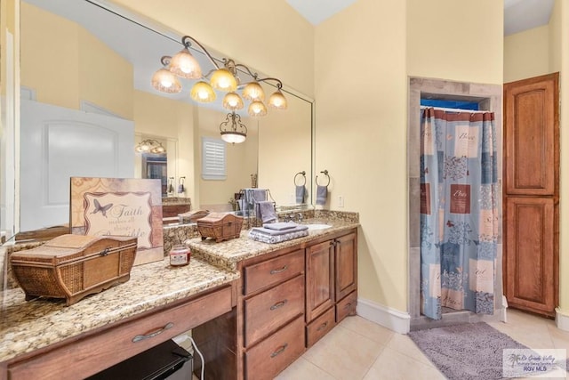 bathroom with tile patterned floors, vanity, and a shower with shower curtain