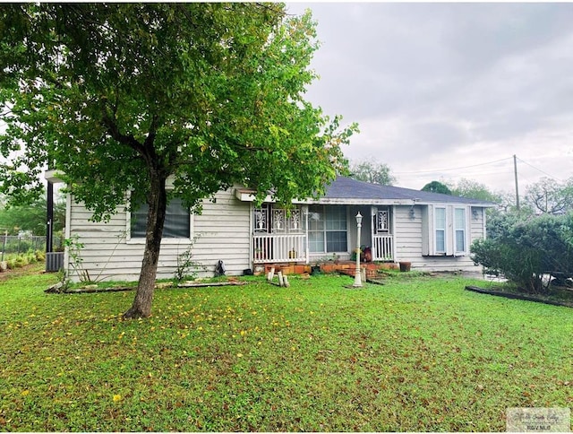 single story home featuring a front yard and central AC