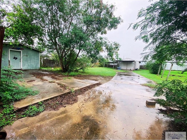 view of yard with a patio and a trampoline