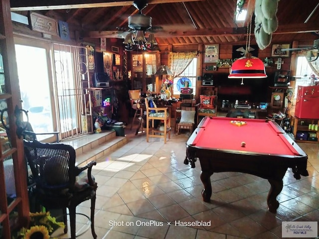 game room featuring beamed ceiling, wood ceiling, tile patterned floors, and pool table