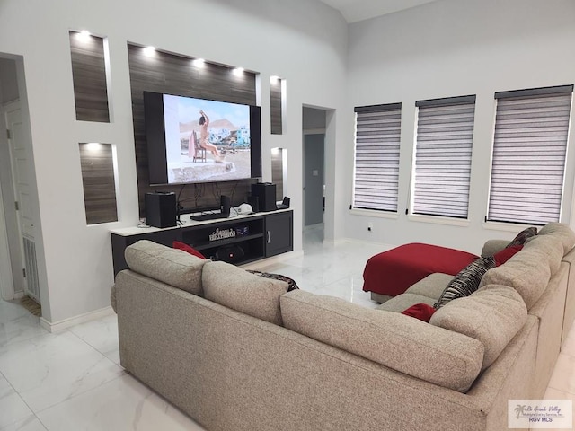 living room with a towering ceiling