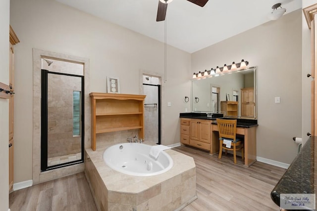 bathroom with hardwood / wood-style floors, vanity, shower with separate bathtub, and ceiling fan