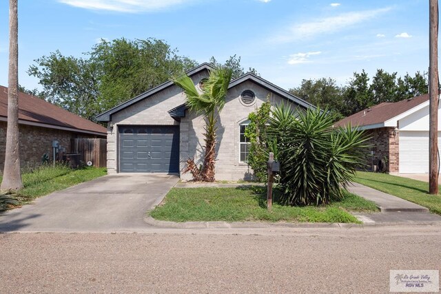 view of front of house featuring an attached garage and concrete driveway