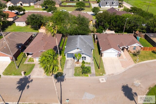 birds eye view of property with a residential view