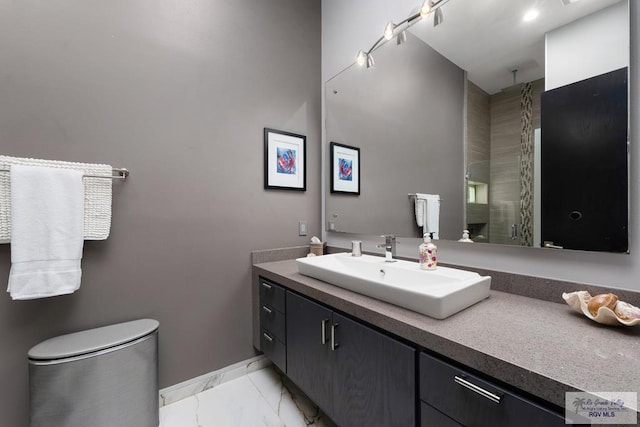 bathroom featuring vanity, toilet, and an enclosed shower