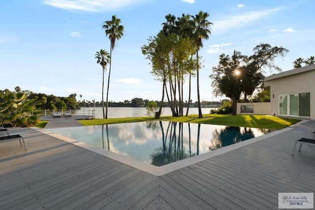 view of pool with a water view