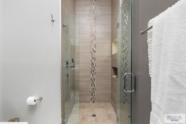 bathroom featuring an enclosed shower