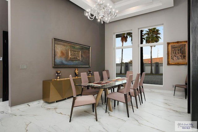 dining area featuring a notable chandelier