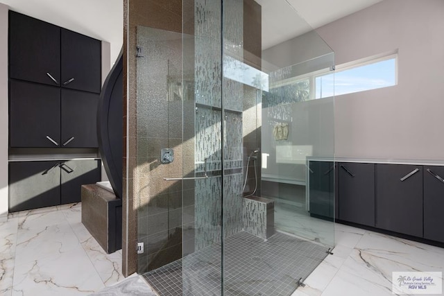 bathroom featuring an enclosed shower