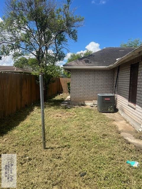 view of yard with central AC