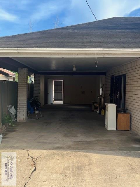 garage featuring a carport