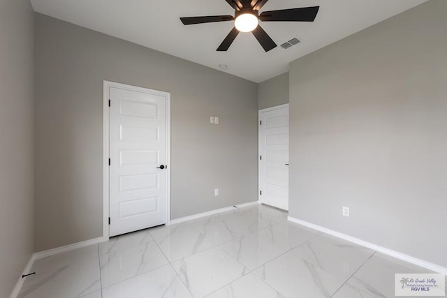 spare room with ceiling fan