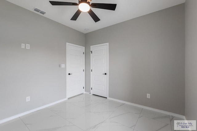 spare room with ceiling fan