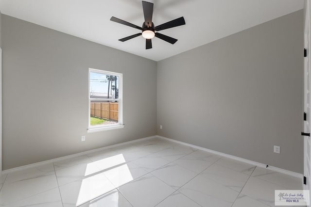 spare room with ceiling fan