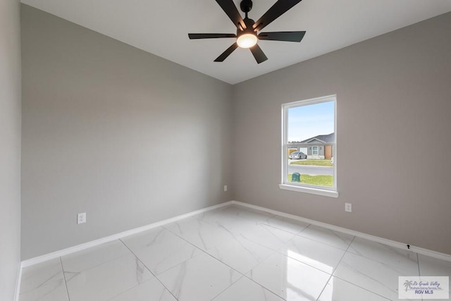 spare room with ceiling fan