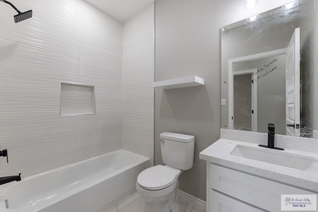 full bathroom featuring vanity, toilet, and tiled shower / bath