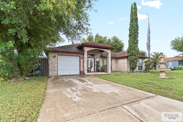 view of front facade featuring a front yard and a garage