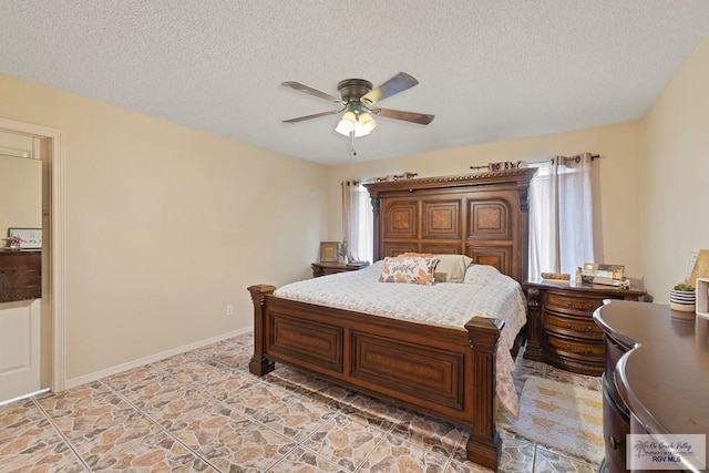 bedroom featuring a textured ceiling and ceiling fan