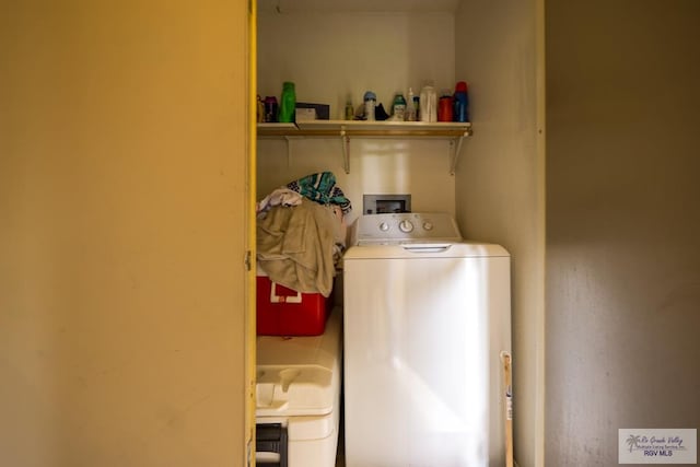 laundry room with laundry area and washer / clothes dryer