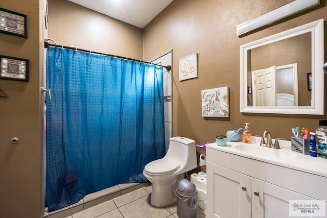 full bathroom featuring vanity, toilet, a shower with shower curtain, and tile patterned flooring
