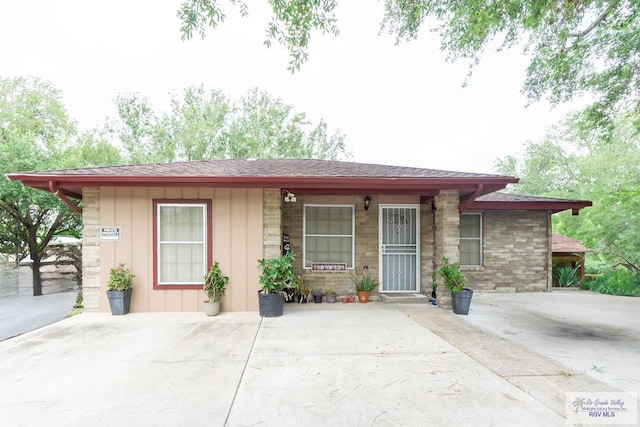 view of front of property featuring roof with shingles