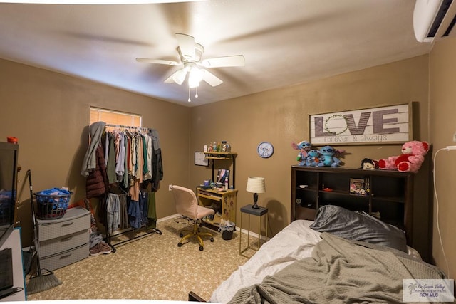 carpeted bedroom with baseboards, a wall unit AC, and ceiling fan