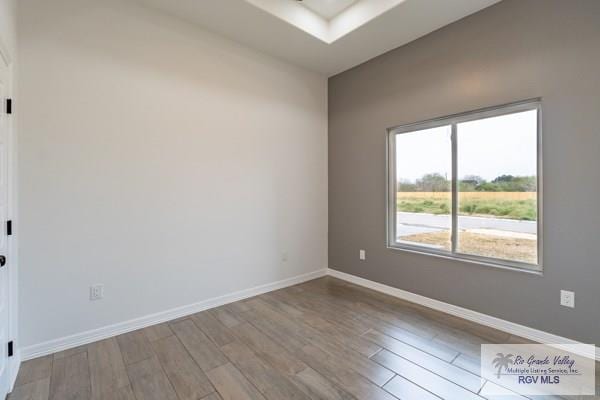 empty room featuring hardwood / wood-style flooring