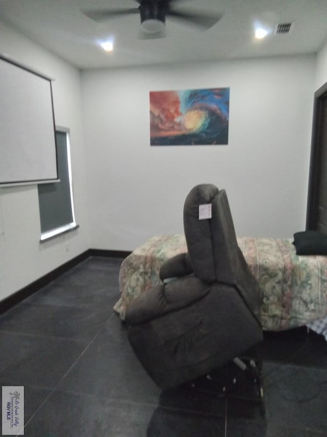 sitting room featuring ceiling fan