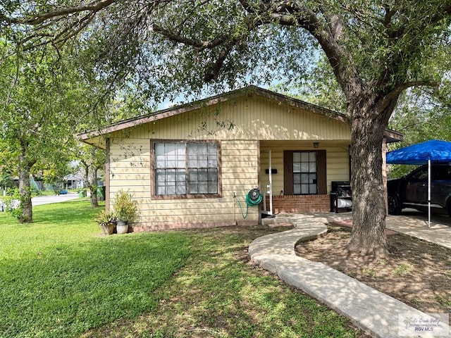 bungalow with a front lawn