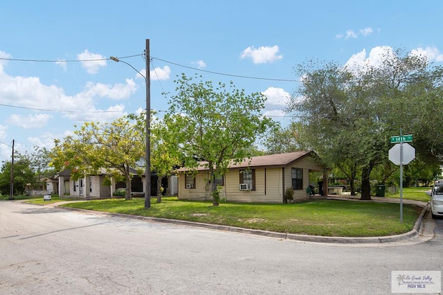 ranch-style home with a front lawn